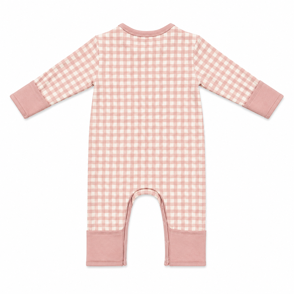 A baby long-sleeve footless romper in a dusty pink and white gingham check pattern, featuring solid dusty pink cuffs and leg cuffs, shown flat on a white background.