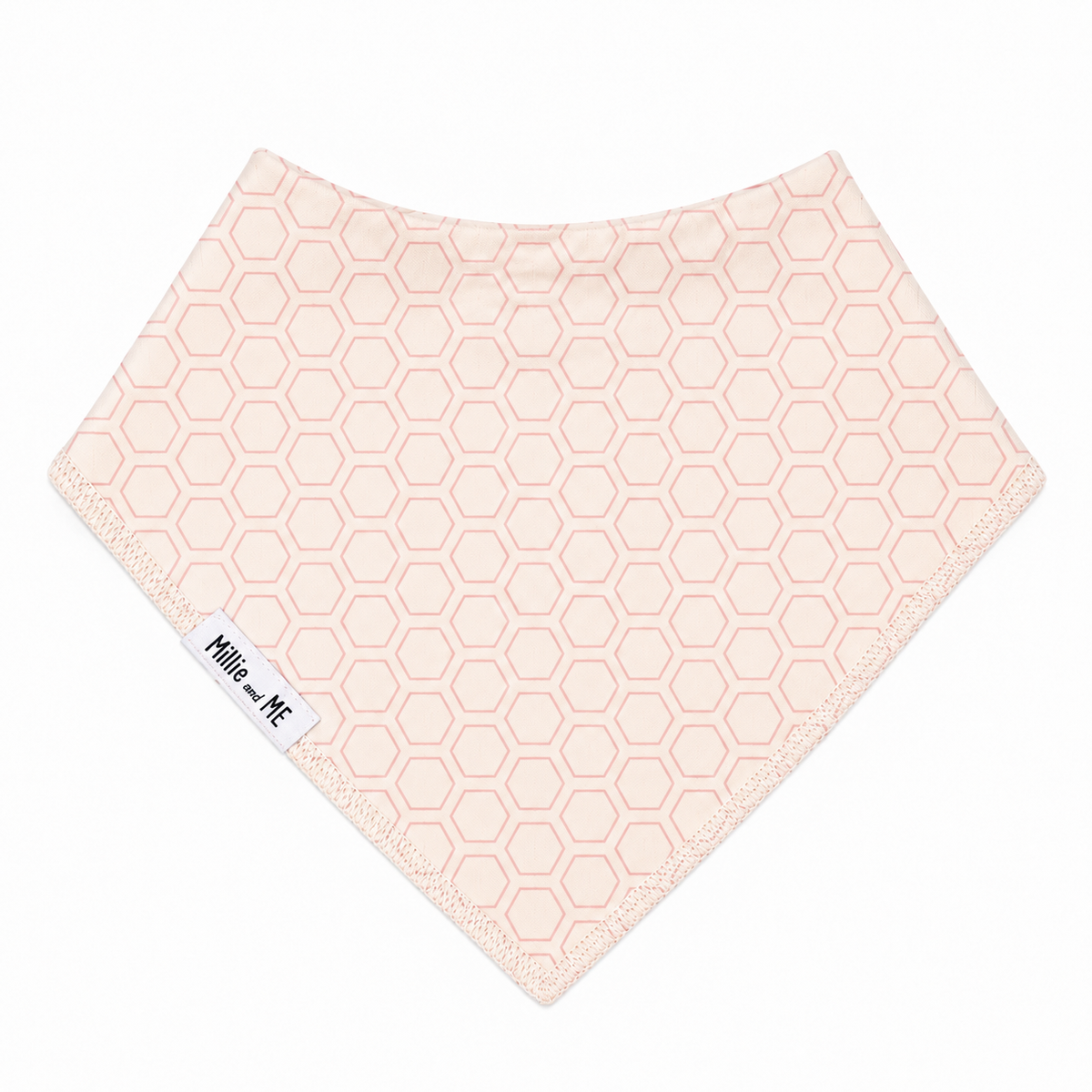 Millie and Me Honeycomb Peach Blossom Bandana Bib, featuring a delicate honeycomb pattern in soft peach blossom pink on a cream background, with a 100% organic cotton front and adjustable nickel-free poppers for babies from newborn to 24 months.