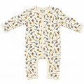 A baby long-sleeve footless sleeper in cream with a colourful pattern of hand-drawn kites and vines. The brand name 'Millie and Me' is visible on the inner neck label.