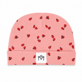 Baby beanie hat in pink with red ladybug print and folded cuff.