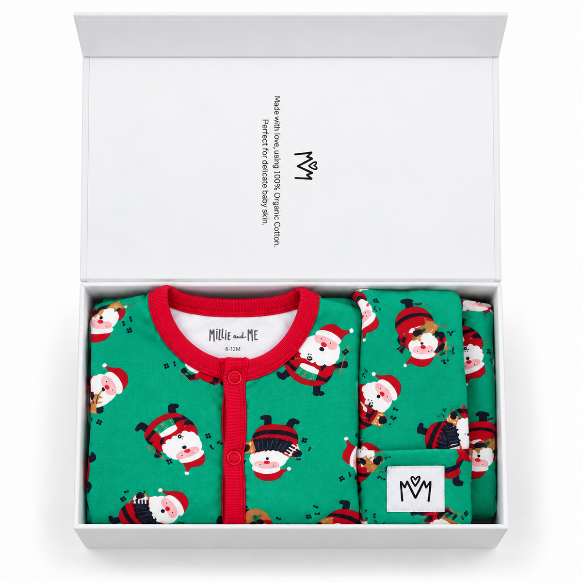 Millie and Me Christmas baby gift box featuring a green Santa print organic cotton baby romper with red trim and matching bib and hat, a thoughtful festive gift for a newborn.