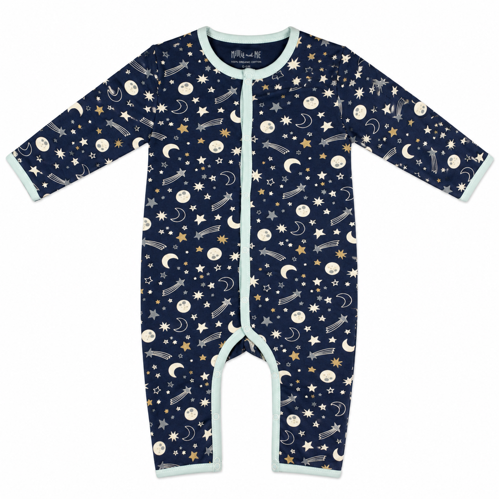 A baby long-sleeve footless one-piece sleeper in navy blue with a celestial print of stars, moons, and shooting stars, finished with light blue trim.