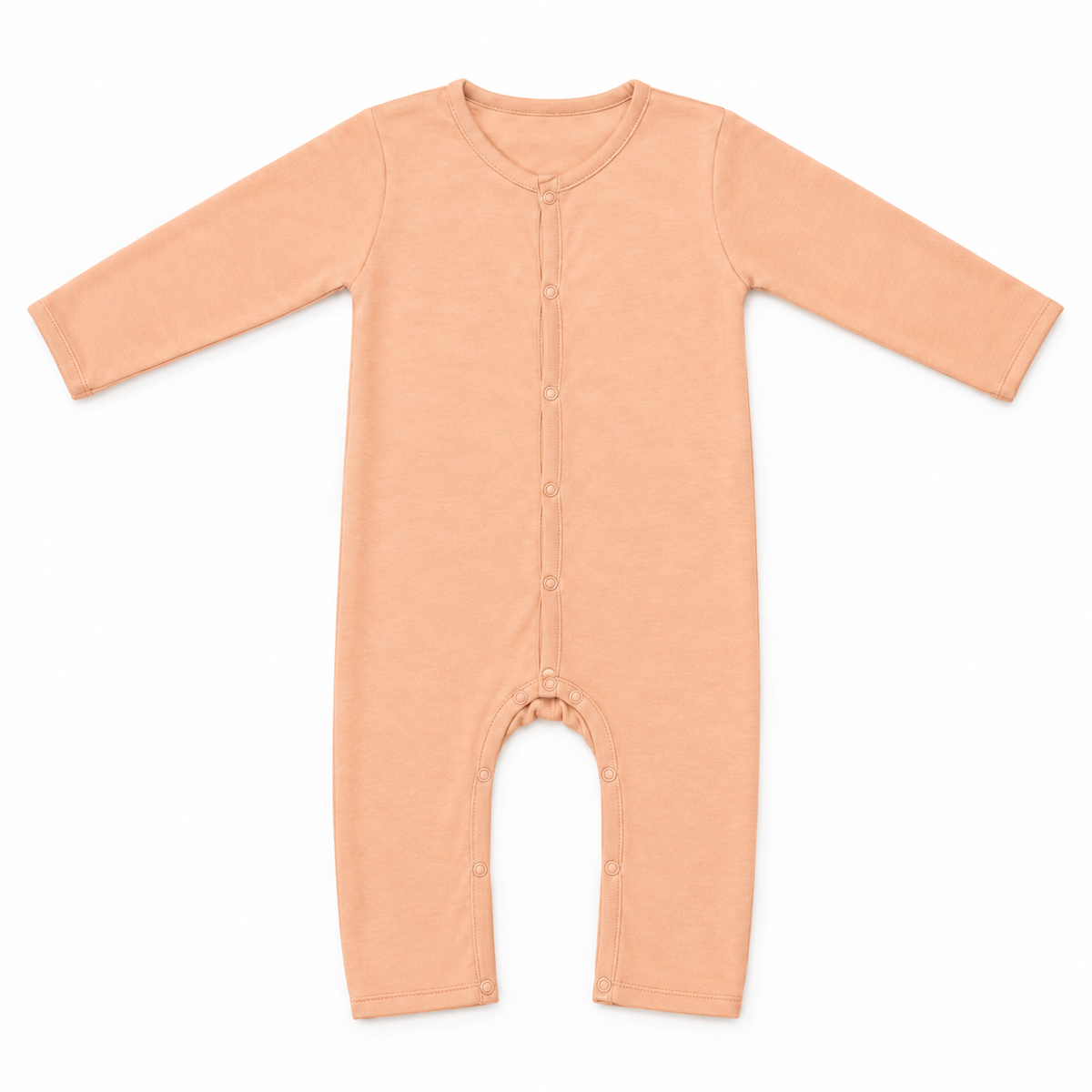 Peach-coloured long-sleeve baby romper with a front button fastening and full-length legs, photographed flat on a white background.