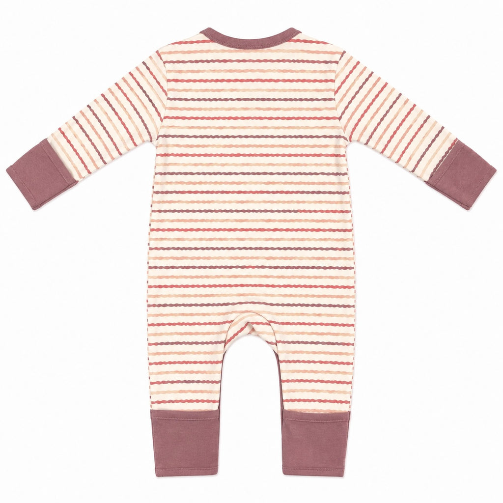 A baby long-sleeve footless jumpsuit shown from the back, featuring a cream base with horizontal wavy stripes in dusty pink, brown, and gray, finished with solid dusty mauve cuffs and leg openings.