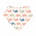 bandana bib with a pink and blue whale pattern on a cream background