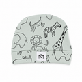 A baby beanie hat in a pale sage green colour, featuring a black line art safari animal print including a lion, zebra, giraffe, and leopard. A white fabric label with the brand initials 'MM' sewn onto the front cuff.